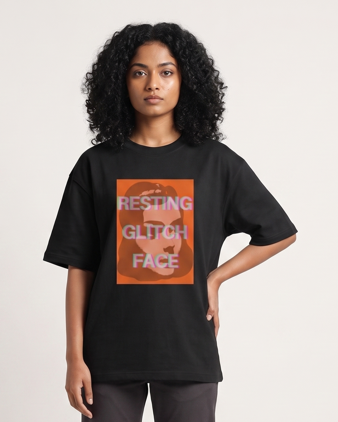 Resting Glitch Face - Chapter26 premium oversized graphic t-shirt, worn by a female model