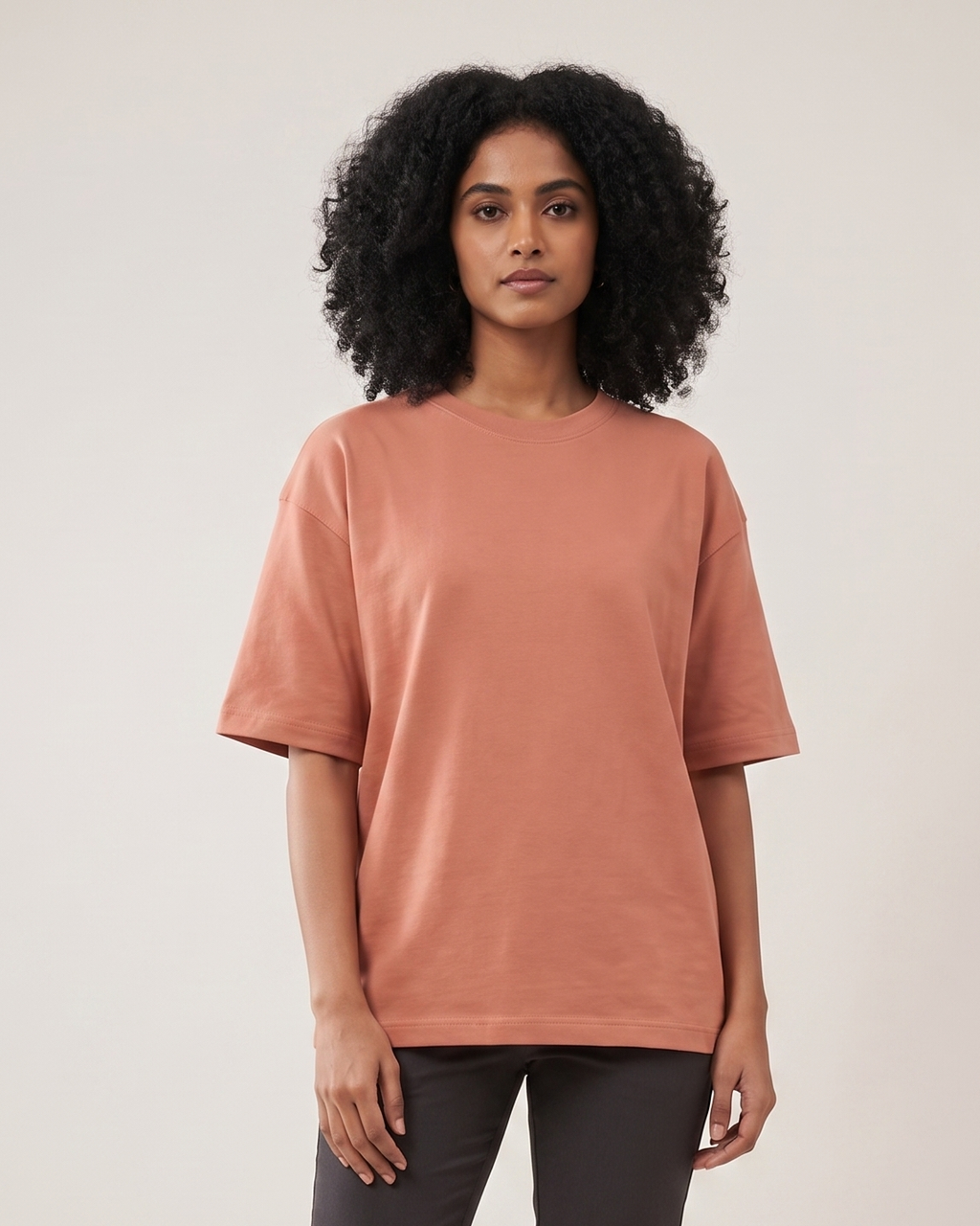 Coral - Chapter26 premium oversized graphic t-shirt, worn by a female model