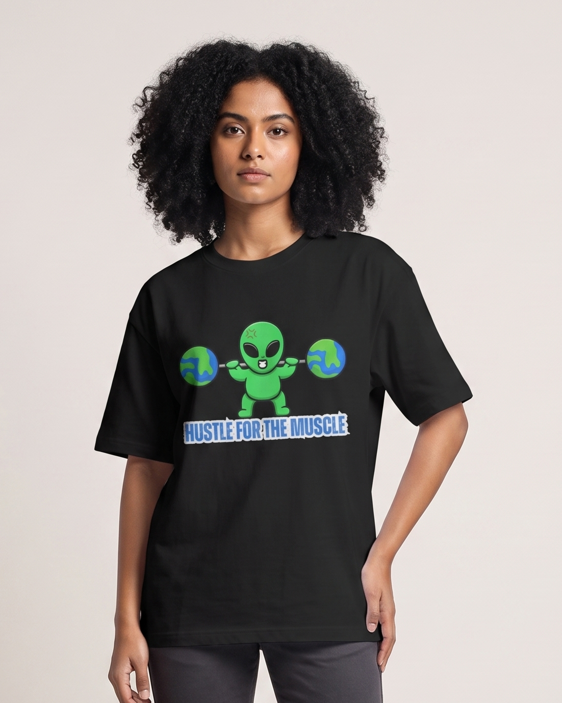 Hustle for the Muscle - Black - Chapter26 premium oversized graphic t-shirt, worn by a female model