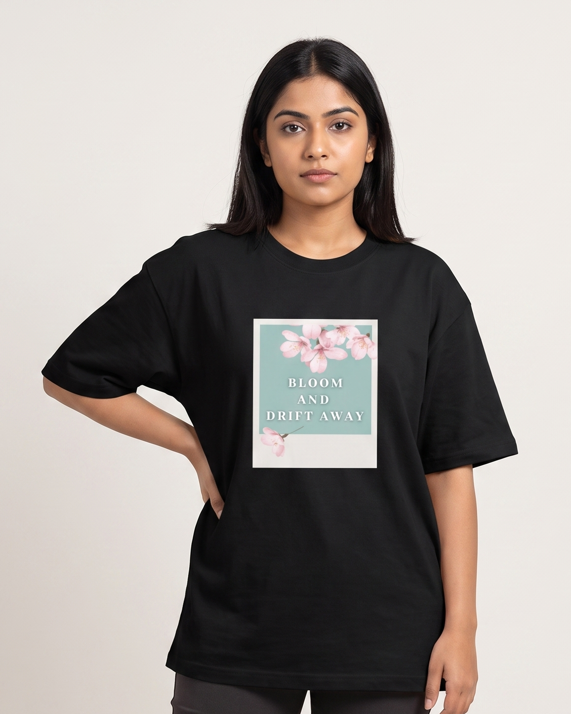 Bloom and Drift Away - Black - Chapter26 premium oversized graphic t-shirt, worn by a female model