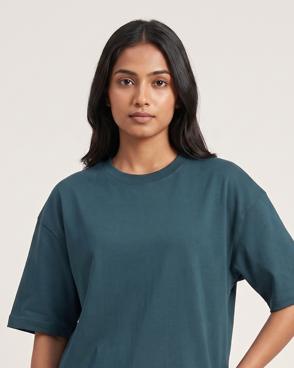 Petrol Blue - Chapter26 premium oversized graphic t-shirt, worn by a female model