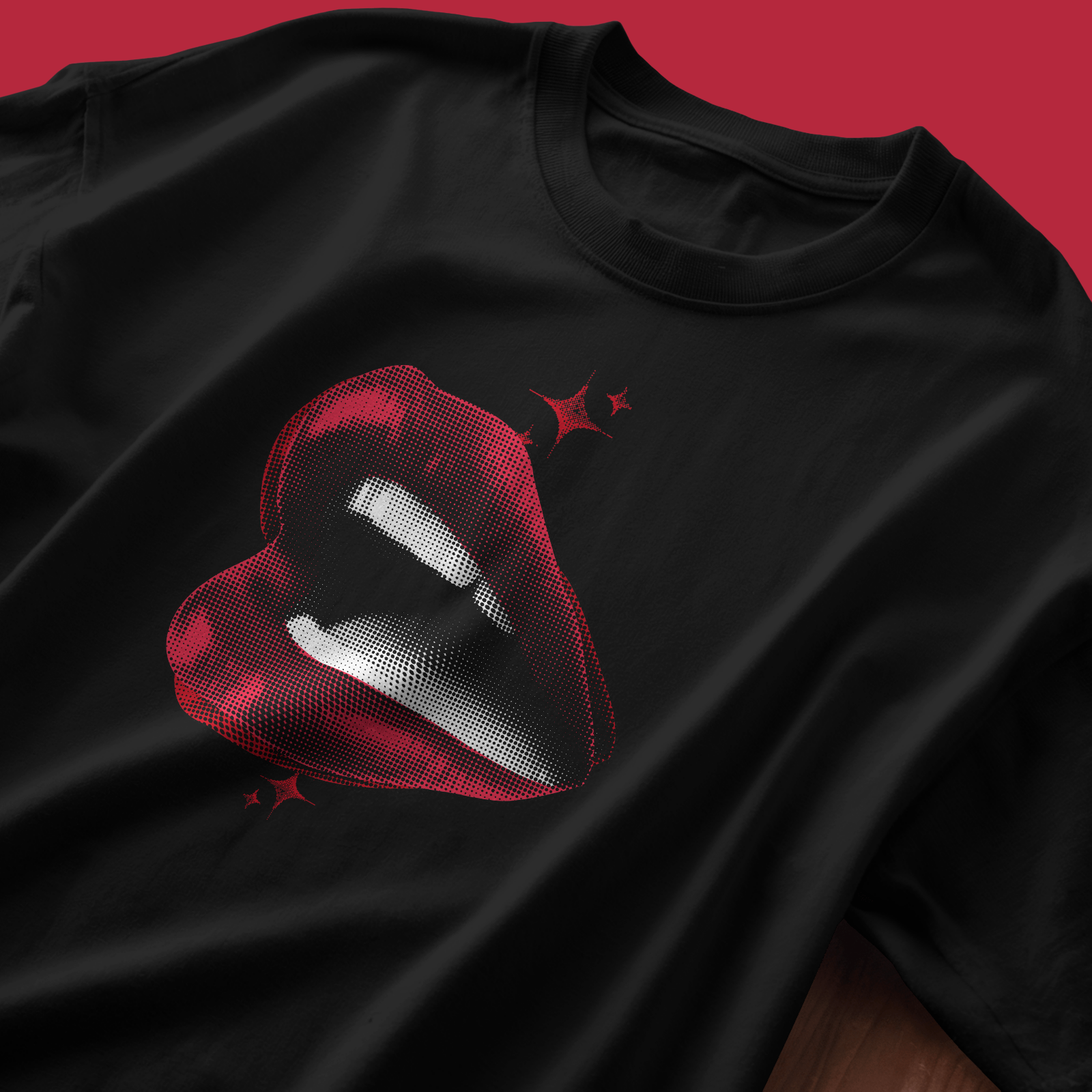 Luscious Red - close-up of the red lips print on Chapter26 black terry cotton t-shirt