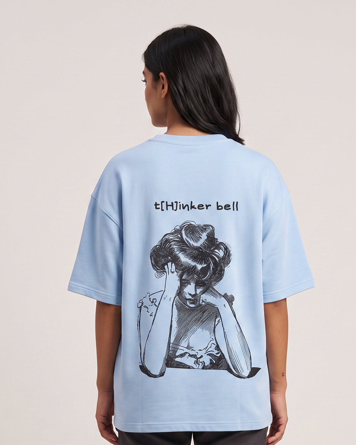 Thinker Bell - Baby Blue - Chapter26 premium oversized graphic t-shirt, back print, worn by a female model