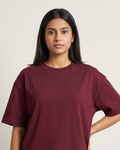 Mega Maroon - Chapter26 premium oversized graphic t-shirt, worn by a female model