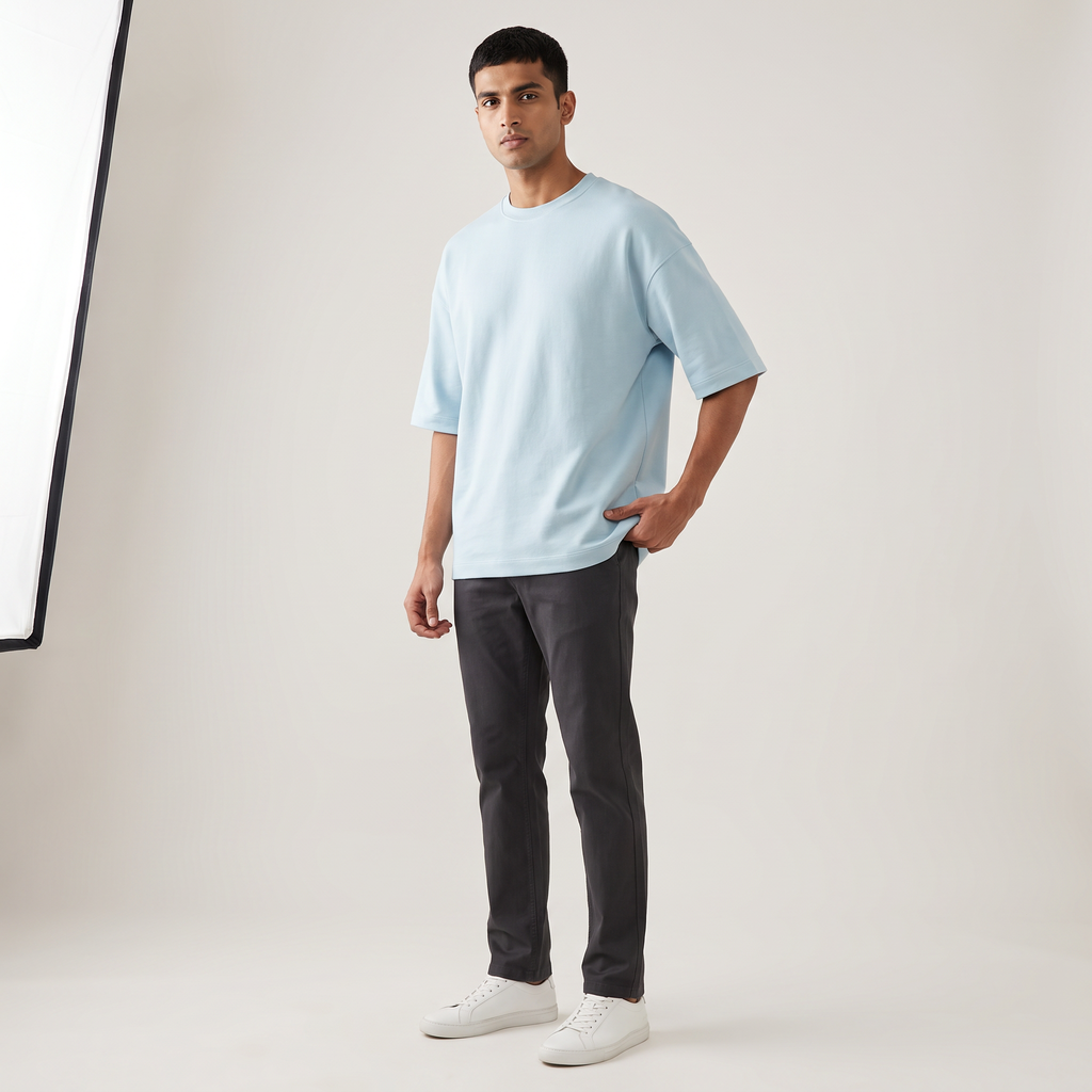 Model wearing Baby Blue oversized t-shirt, front three-quarter view