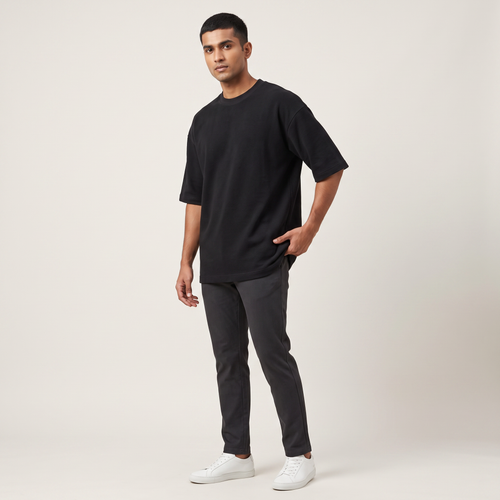 Model wearing Basic Black oversized t-shirt, front three-quarter view