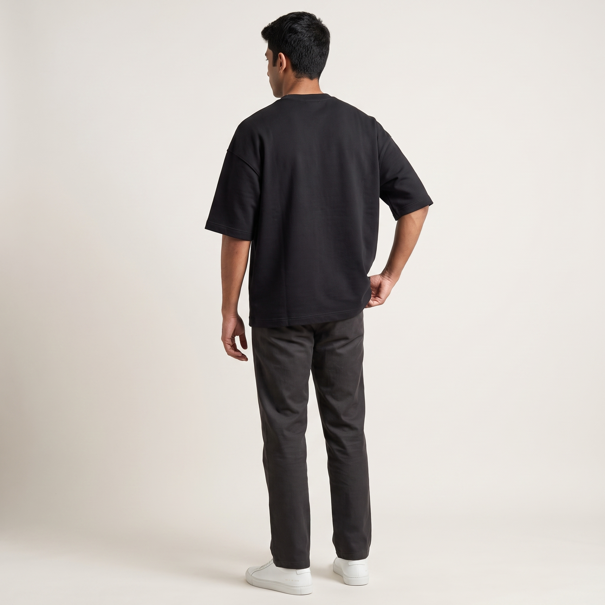 Model wearing Basic Black oversized t-shirt, back view