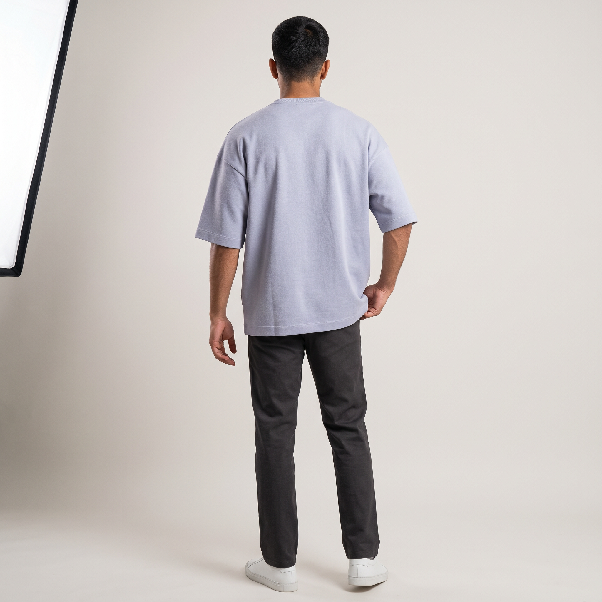 Model wearing Laid Lavender oversized t-shirt, back view