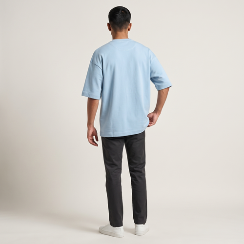 Model wearing Baby Blue oversized t-shirt, back view