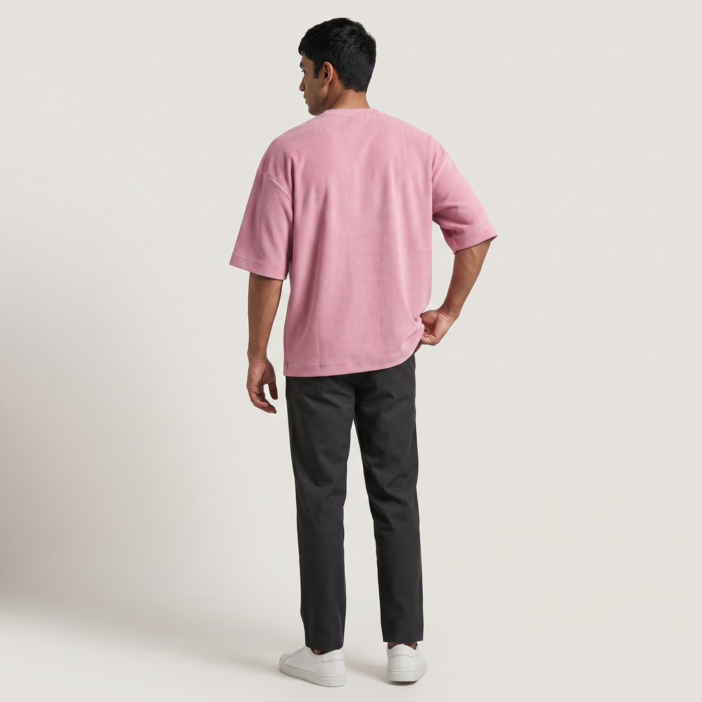 Model wearing Plush Pink oversized t-shirt, back view
