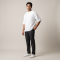 Model wearing Plain White oversized t-shirt, front three-quarter view