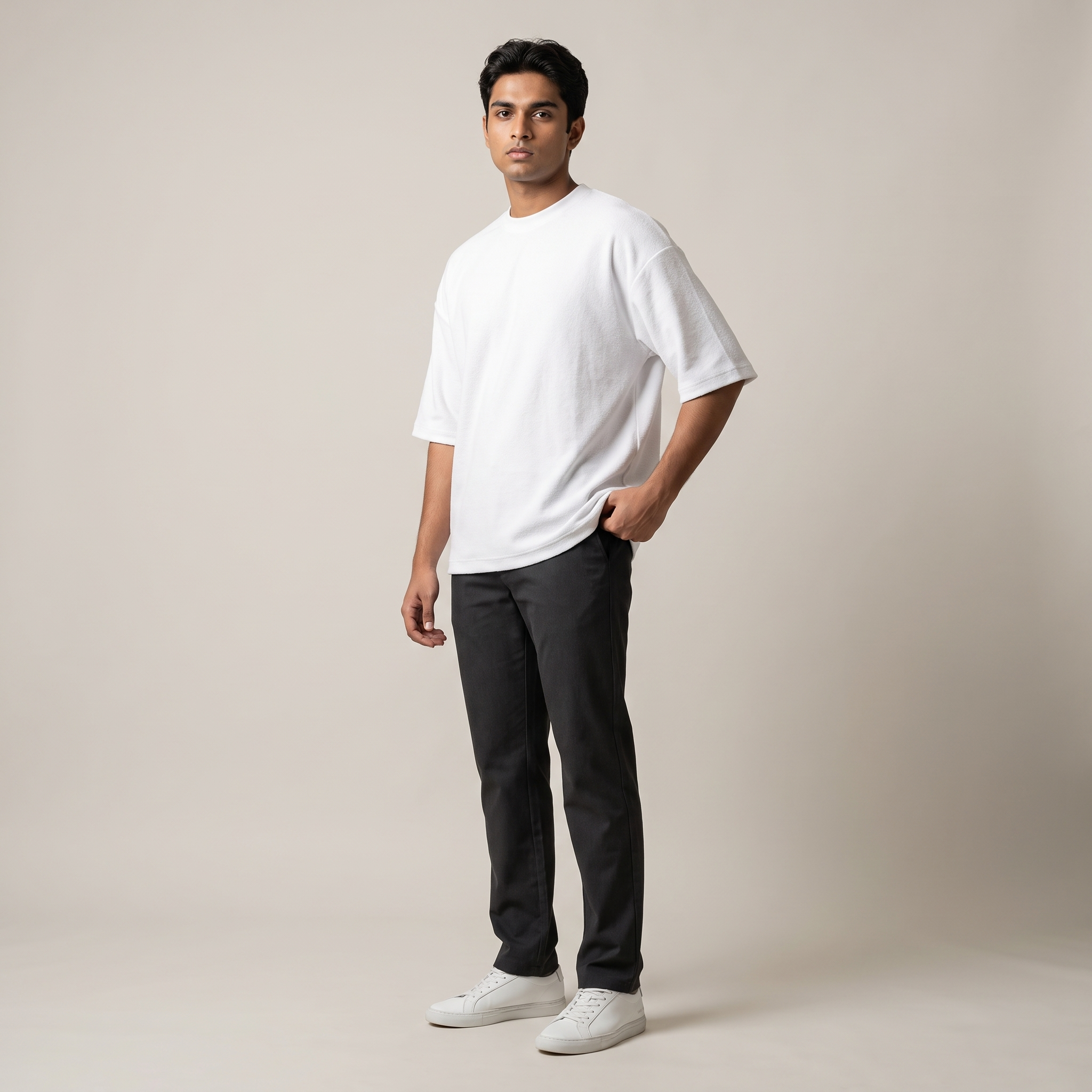 Model wearing Plain White oversized t-shirt, front three-quarter view