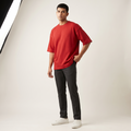 Model wearing Red Rush oversized t-shirt, front three-quarter view