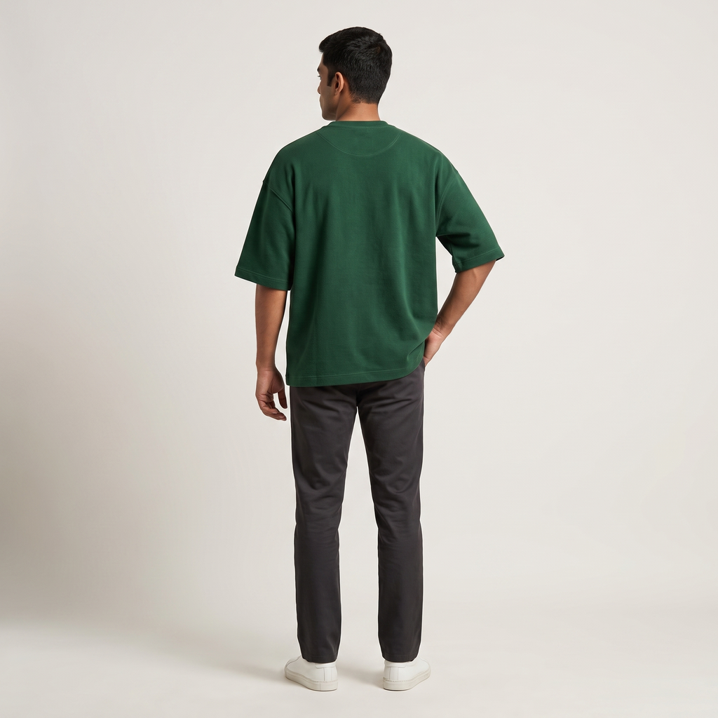 Model wearing Bottle Green oversized t-shirt, back view
