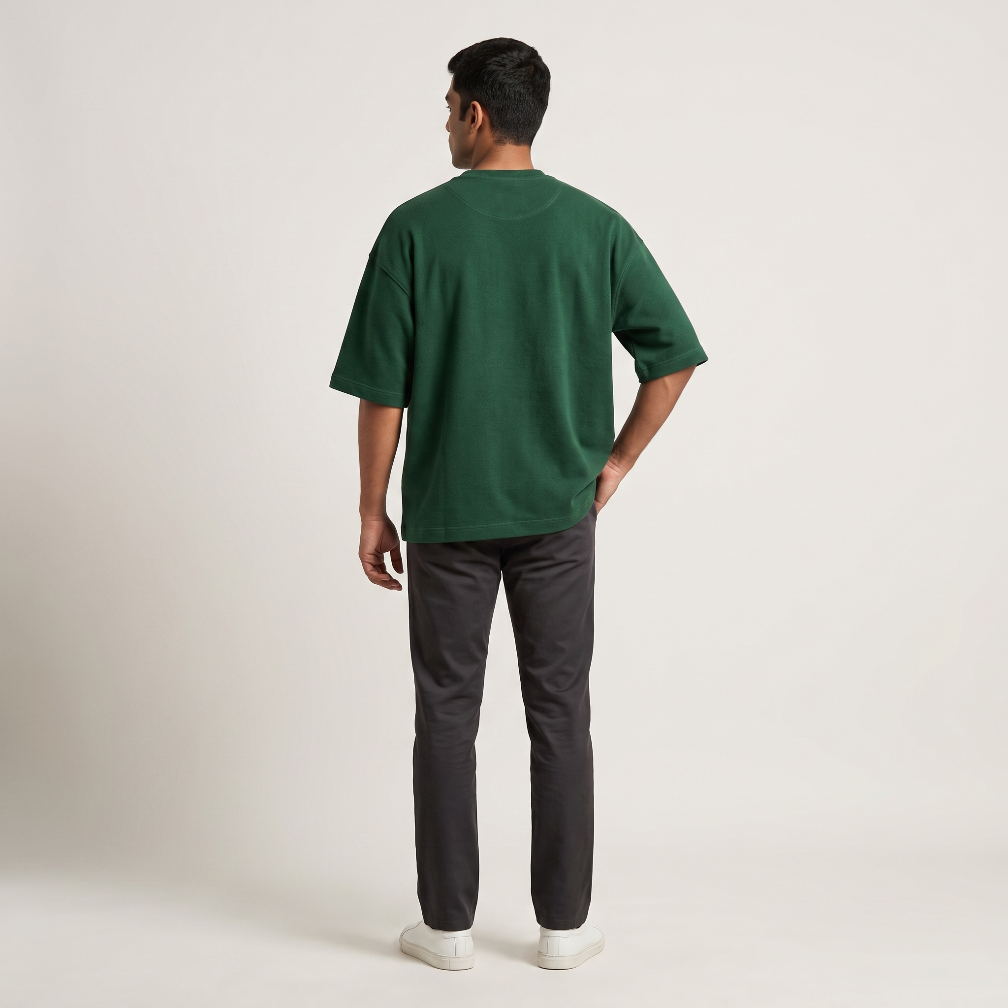 Model wearing Bottle Green oversized t-shirt, back view