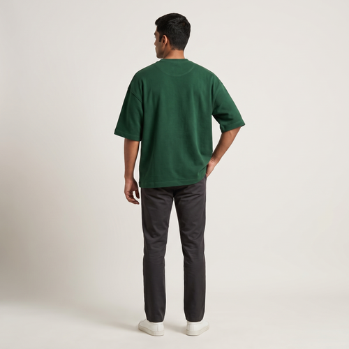 Model wearing Bottle Green oversized t-shirt, back view