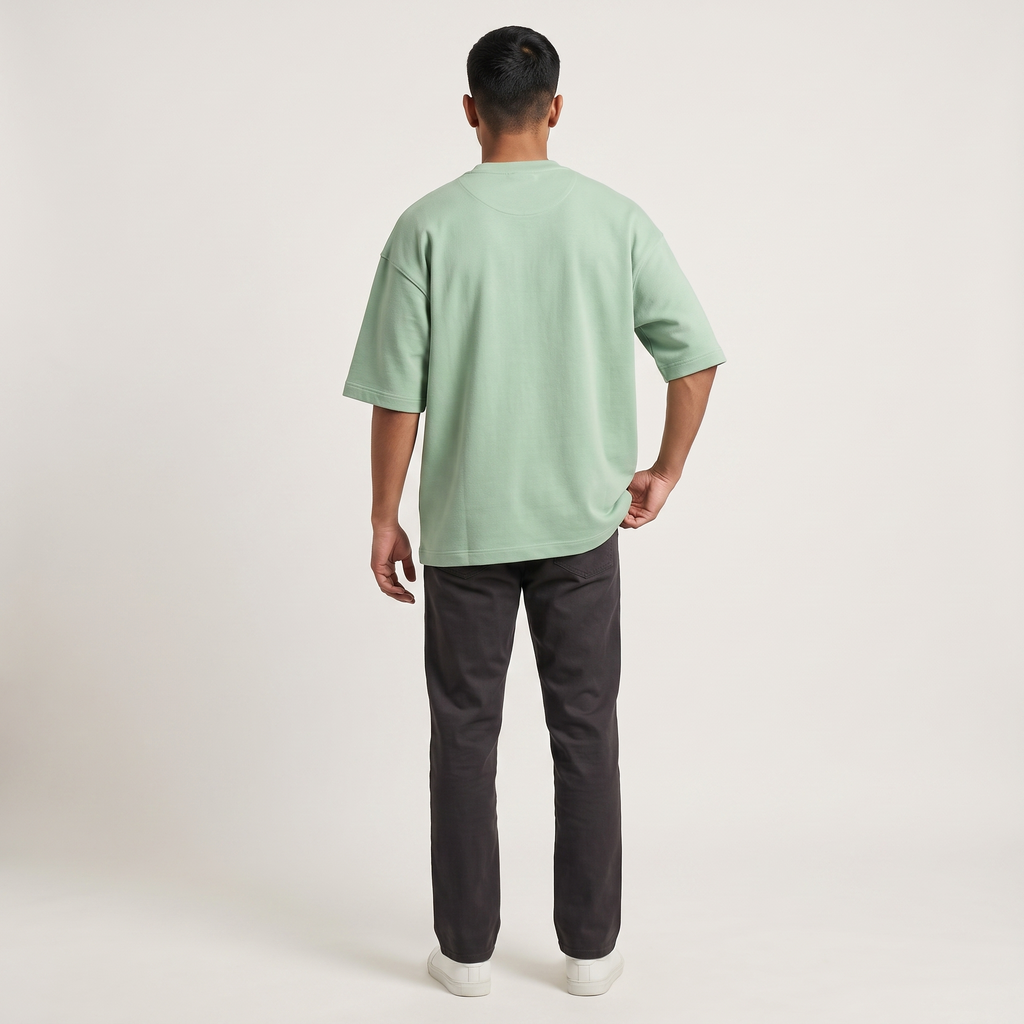 Model wearing Jade oversized t-shirt, back view