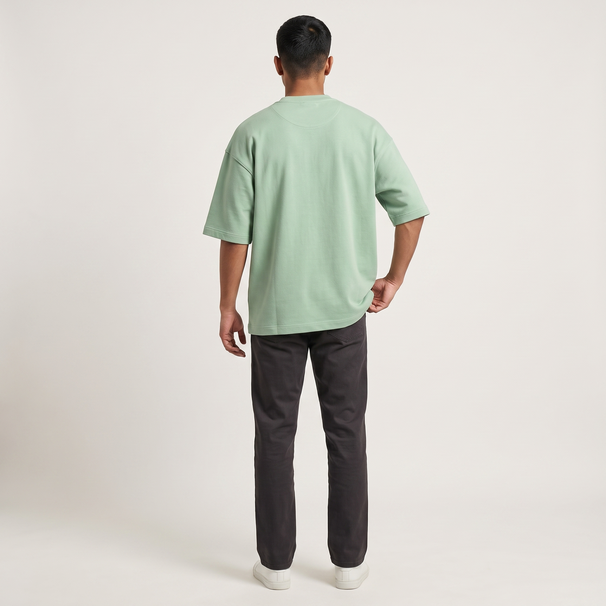 Model wearing Jade oversized t-shirt, back view