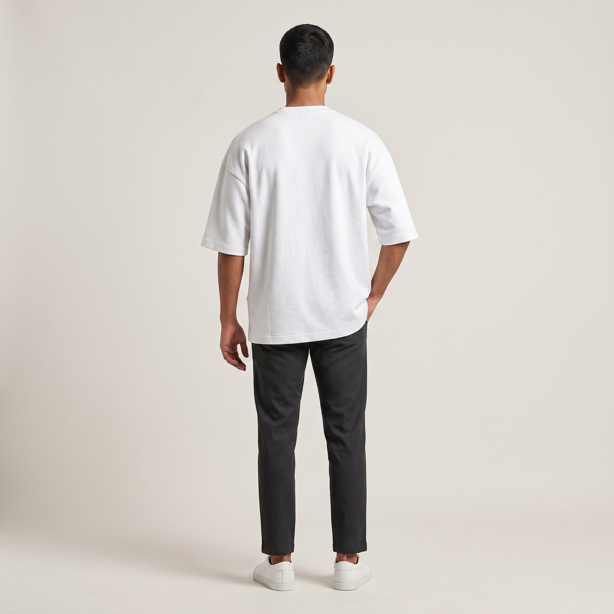 Model wearing Plain White oversized t-shirt, back view