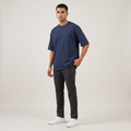 Model wearing Navy classic oversized t-shirt, front three-quarter view