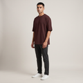 Model wearing Maroon classic oversized t-shirt, front three-quarter view
