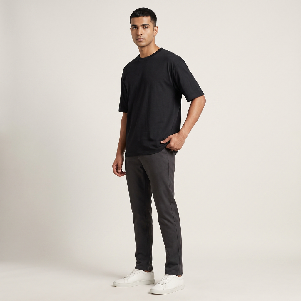Model wearing Black classic oversized t-shirt, front three-quarter view