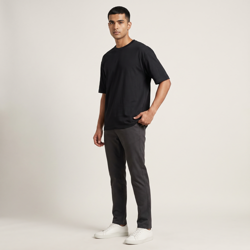Model wearing Black classic oversized t-shirt, front three-quarter view