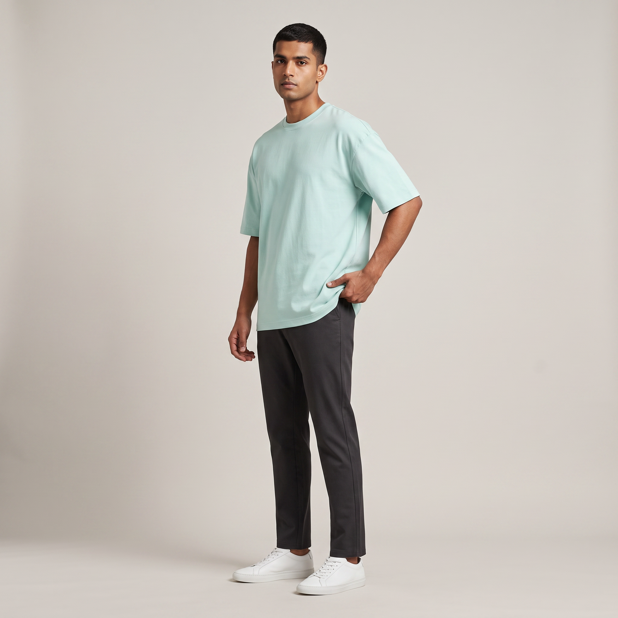 Model wearing Mint classic oversized t-shirt, front three-quarter view