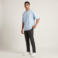 Model wearing Powder Blue classic oversized t-shirt, front three-quarter view