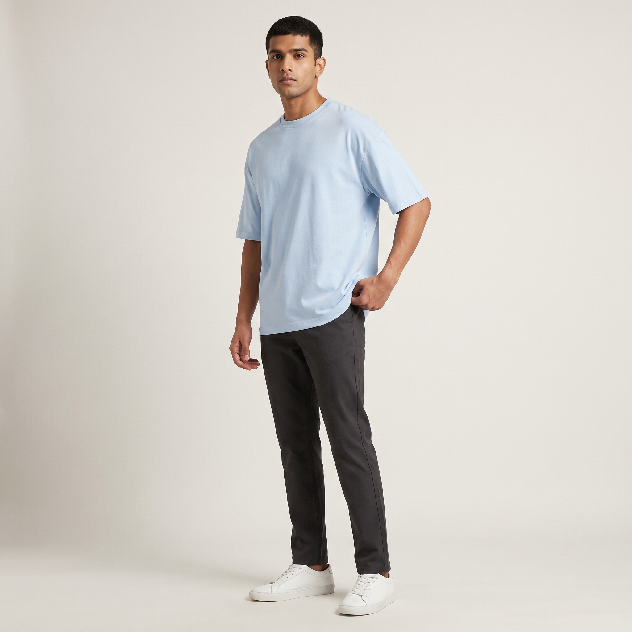Model wearing Powder Blue classic oversized t-shirt, front three-quarter view