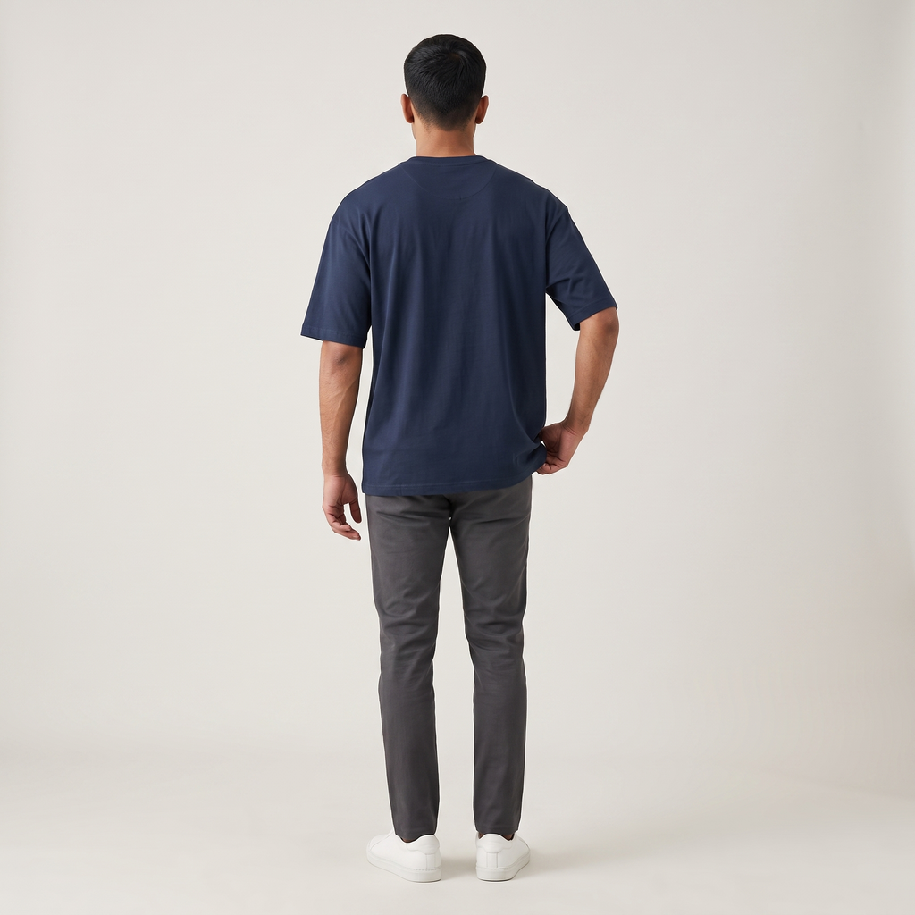 Model wearing Navy classic oversized t-shirt, back view