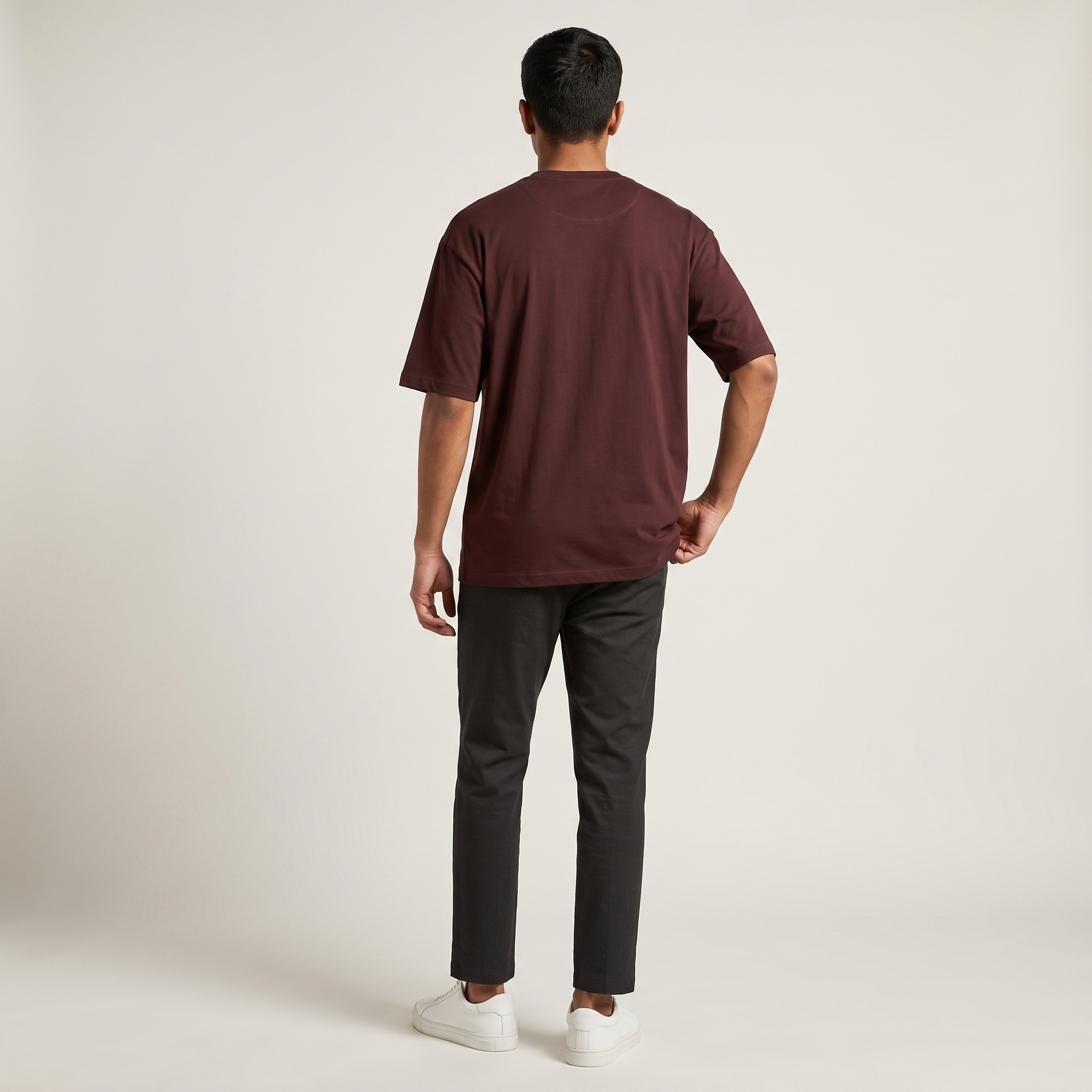 Model wearing Maroon classic oversized t-shirt, back view