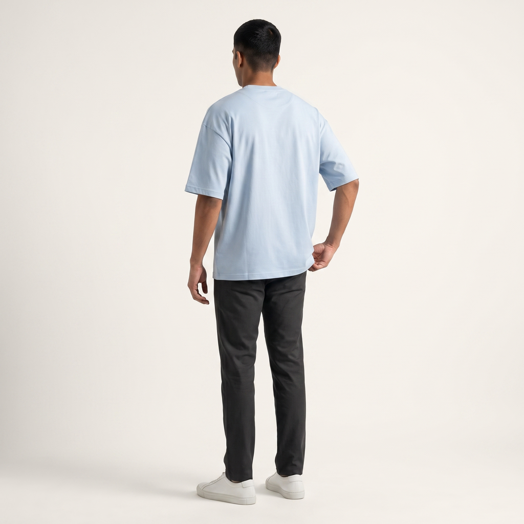 Model wearing Powder Blue classic oversized t-shirt, back view