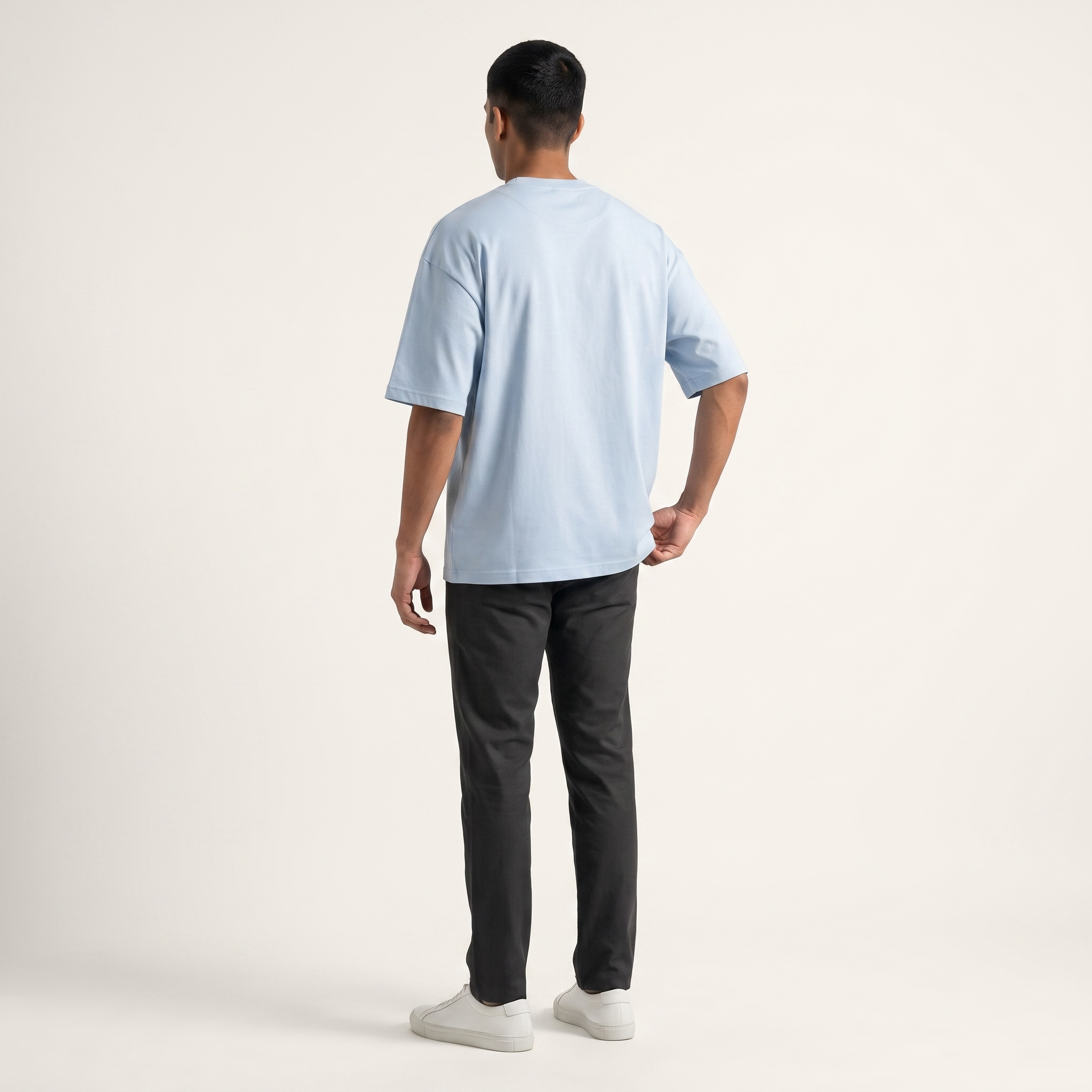 Model wearing Powder Blue classic oversized t-shirt, back view