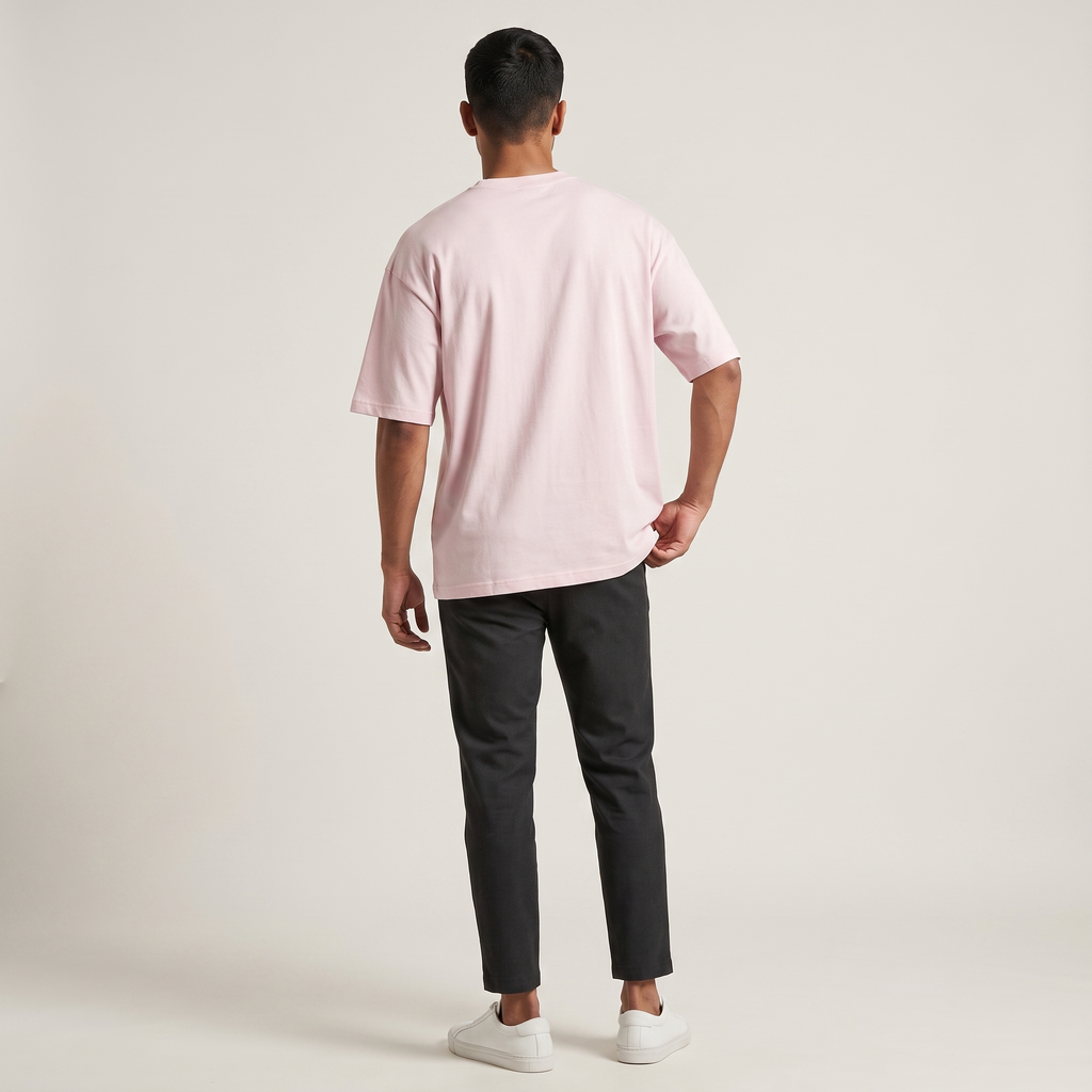 Model wearing Classic Baby Pink oversized t-shirt, back view