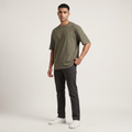 Model wearing Olive classic oversized t-shirt, front three-quarter view