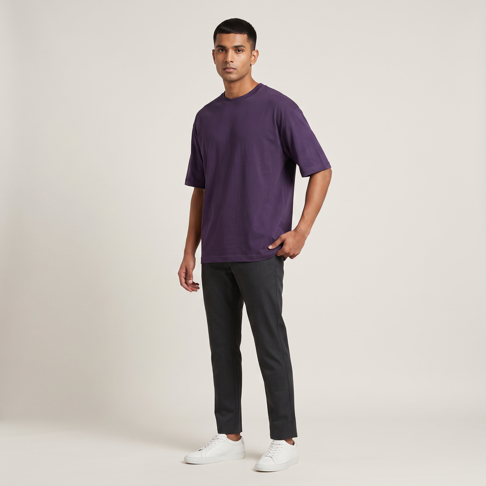 Model wearing Purple classic oversized t-shirt, front three-quarter view