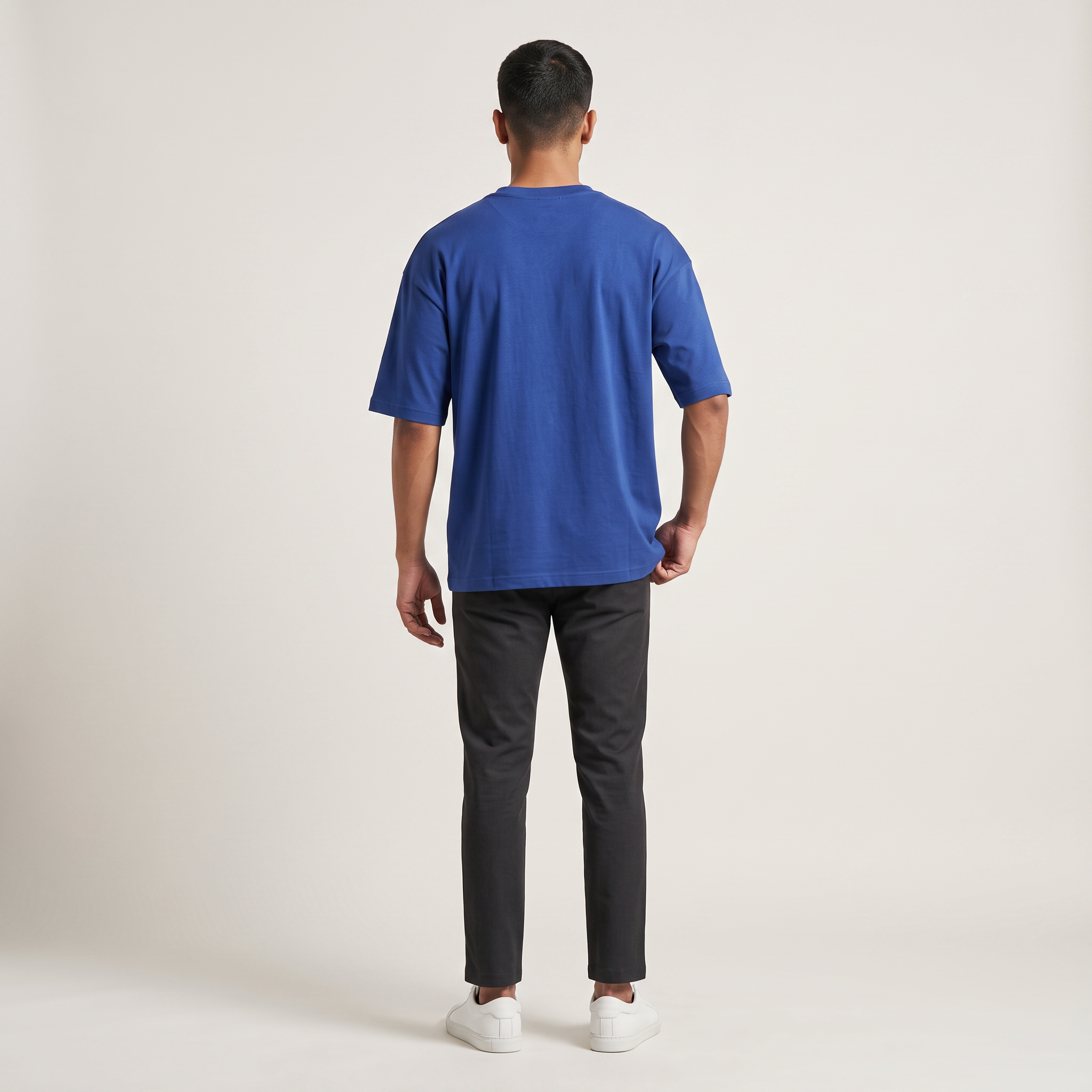 Model wearing Royal Blue classic oversized t-shirt, back view