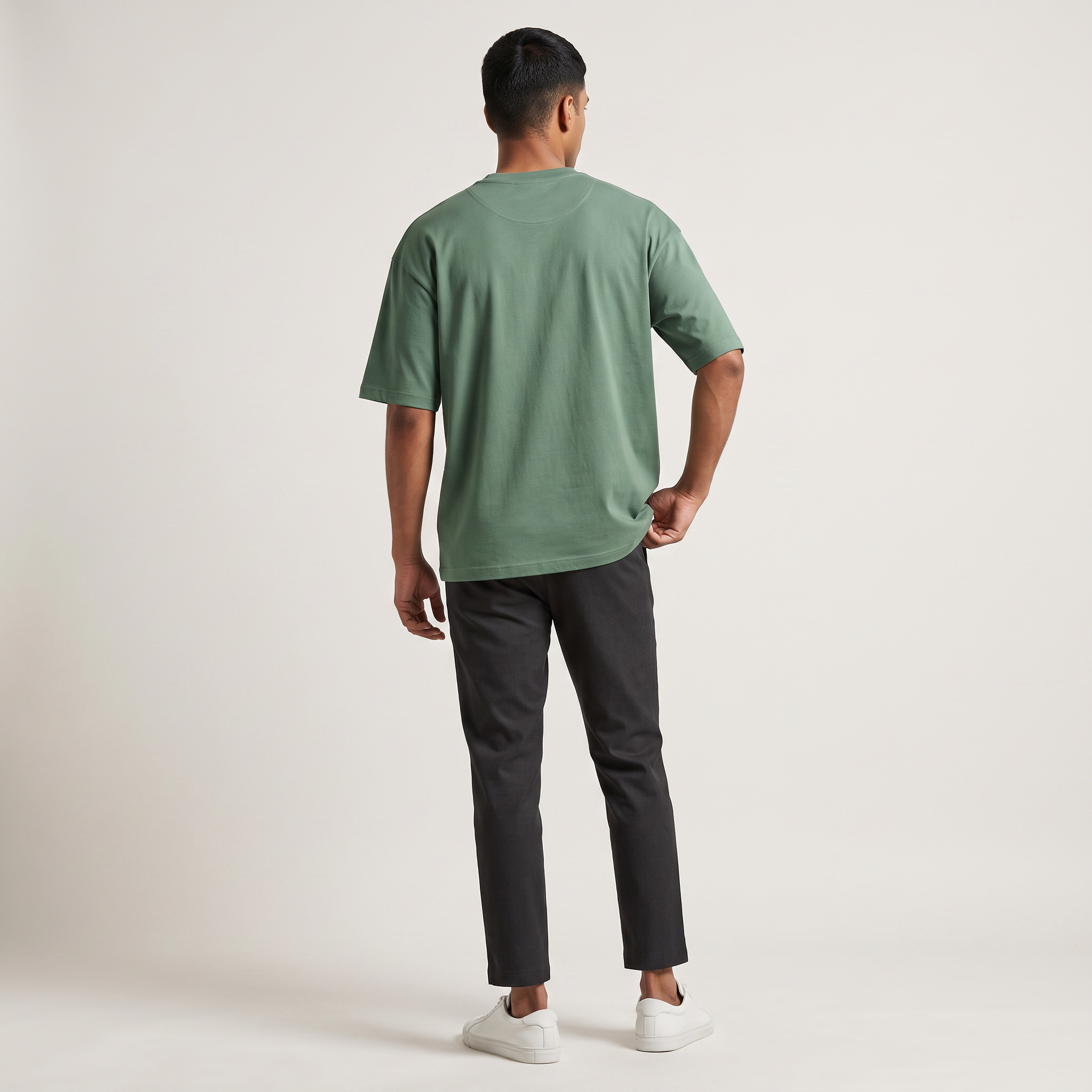 Model wearing Green classic oversized t-shirt, back view