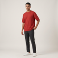 Model wearing Classic Red oversized t-shirt, front three-quarter view