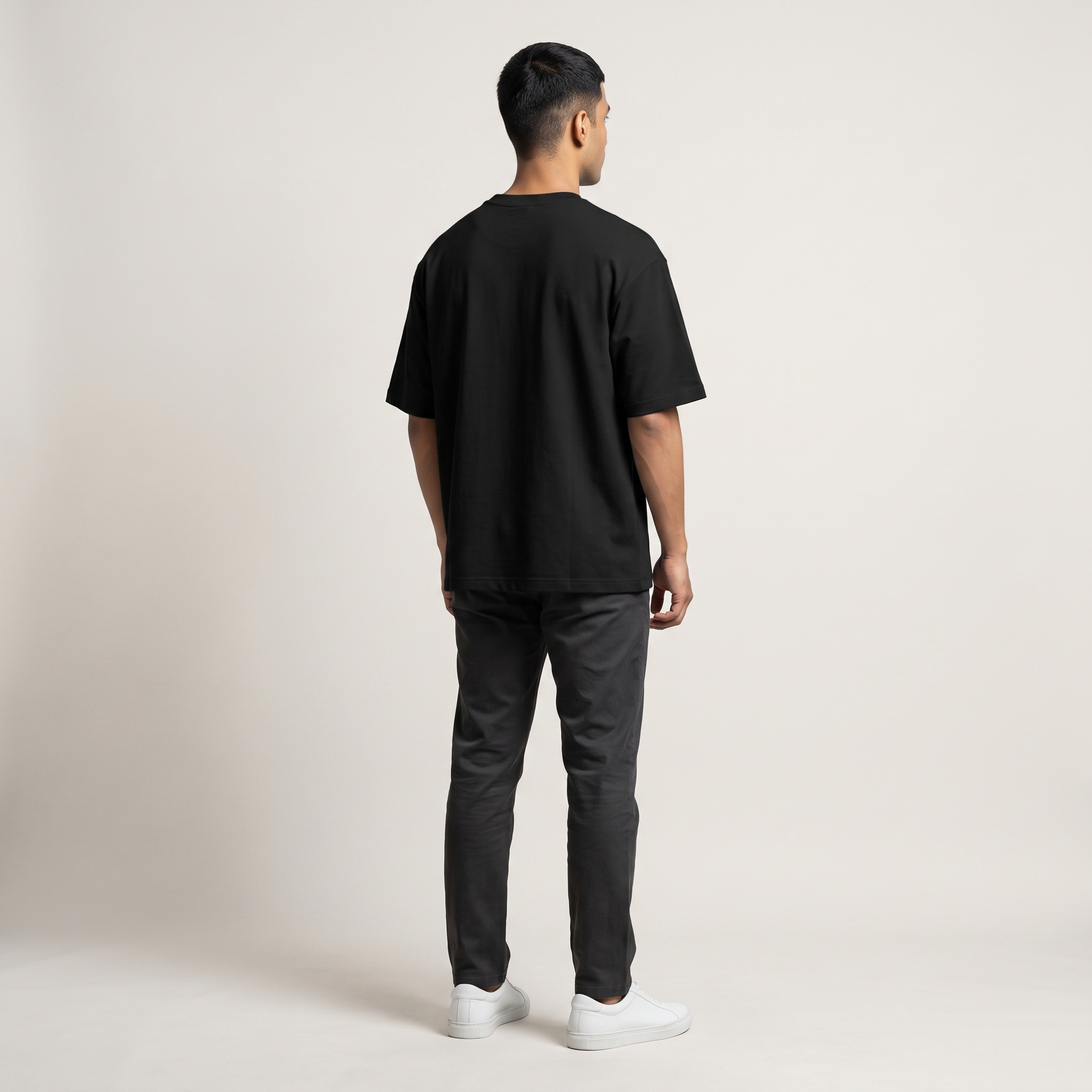 Model wearing Hustle Dark oversized t-shirt, back view