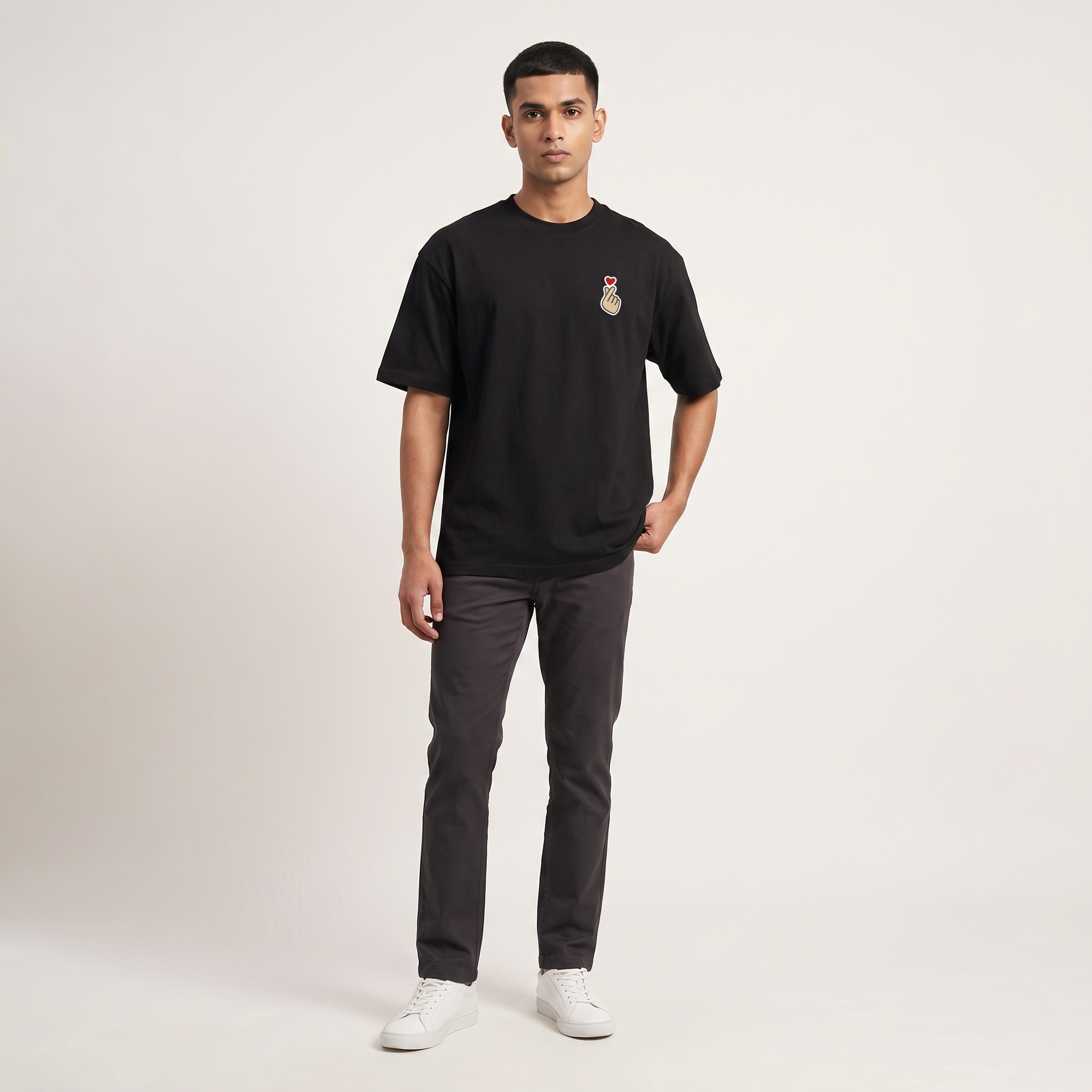 Model wearing K-Love oversized t-shirt, front view showing chest print
