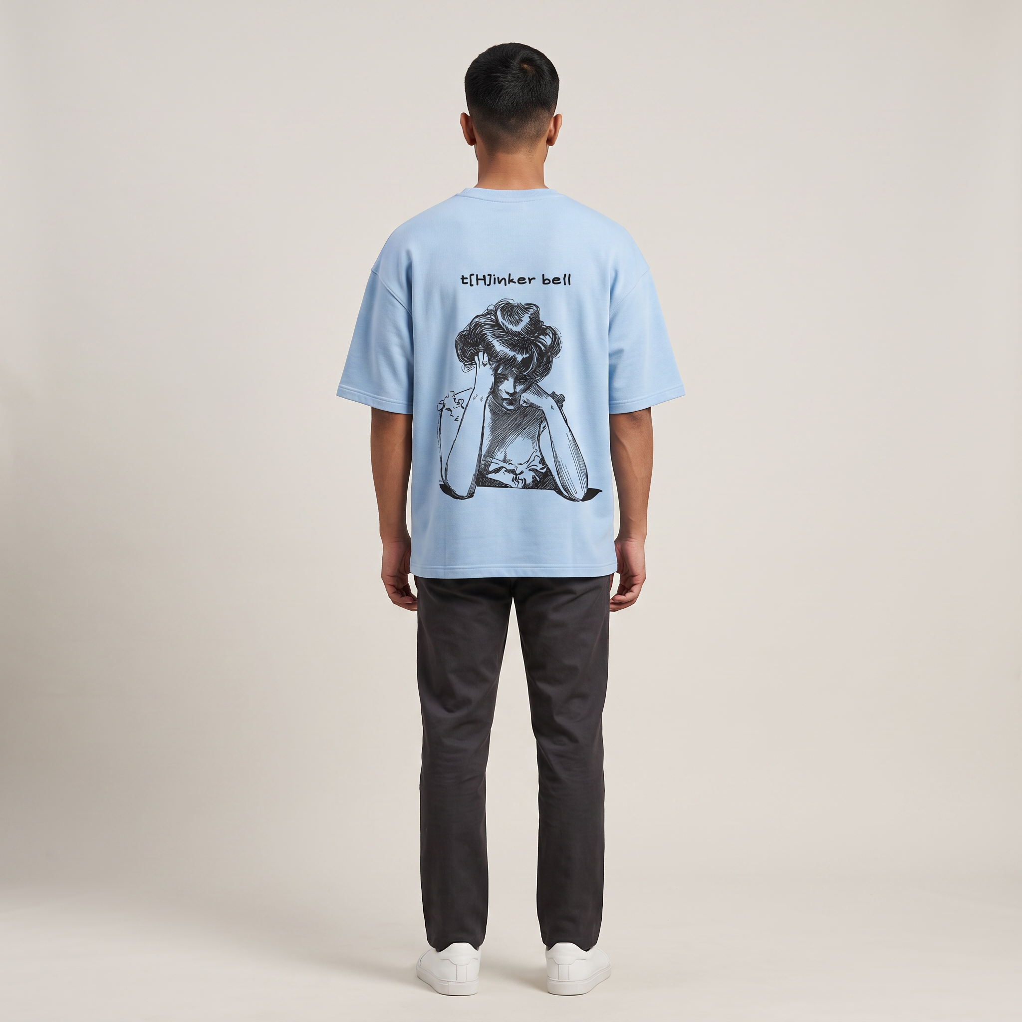 Model wearing Thinker Bell oversized t-shirt, back view showing back print