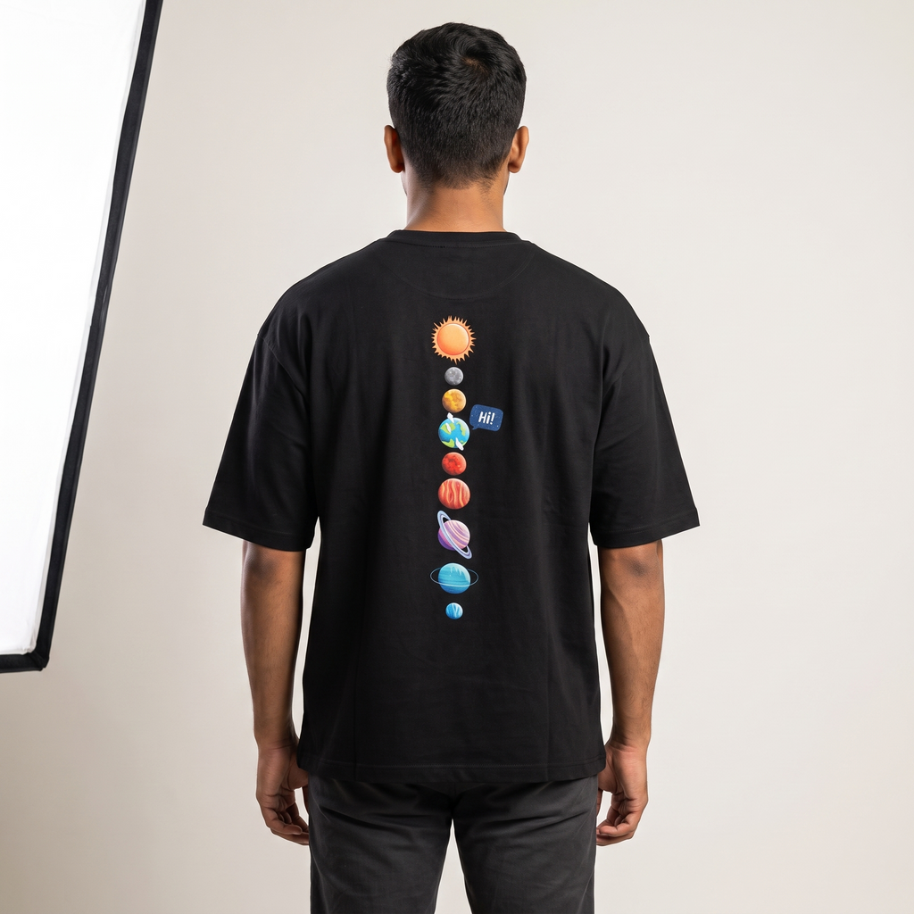 Model wearing Universal Welcome oversized t-shirt, back view showing solar system print