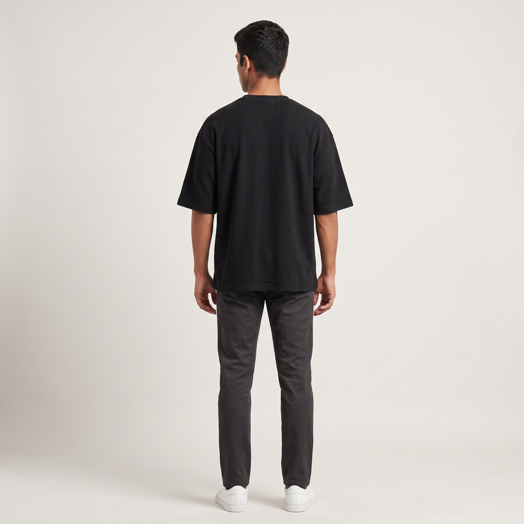 Model wearing Ambitchious oversized t-shirt, back view