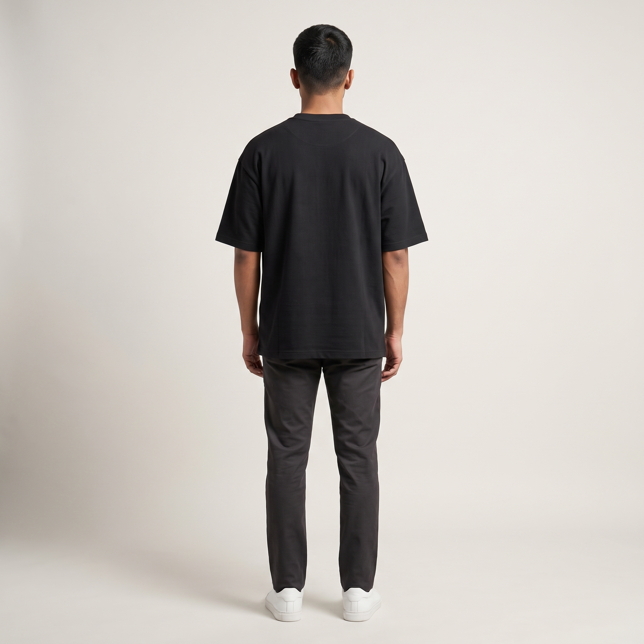 Model wearing Distracted by Coffee Dark oversized t-shirt, back view