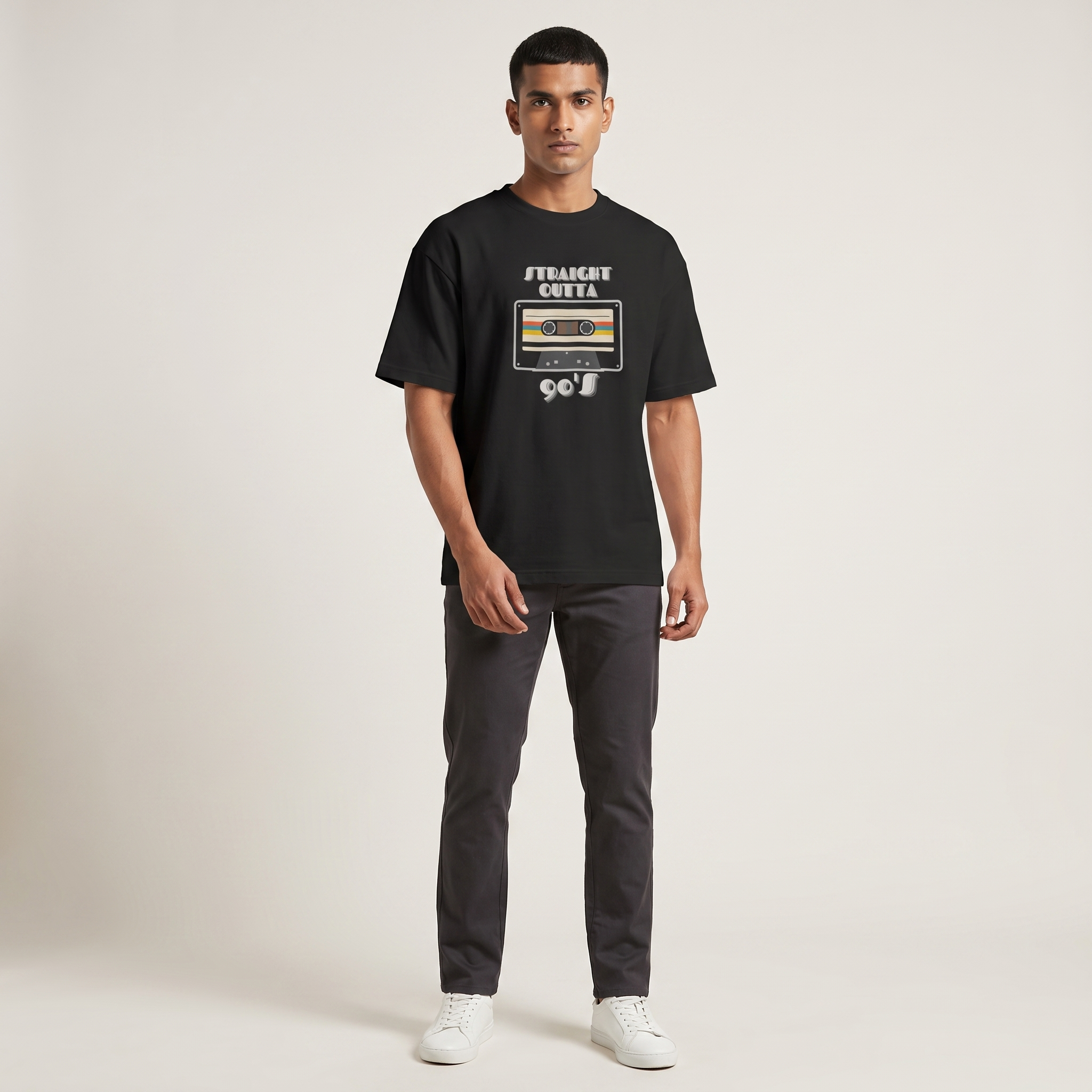 Model wearing Straight Outta 90s oversized t-shirt, front view showing chest print