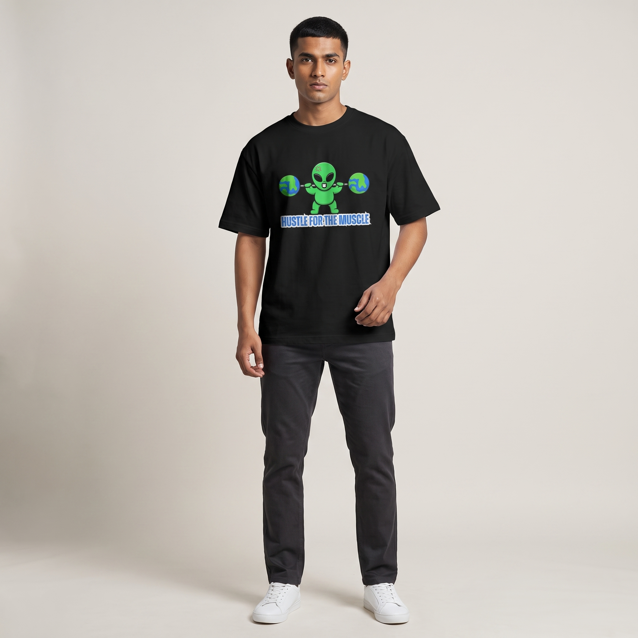 Model wearing Hustle for the Muscle oversized t-shirt, front view showing chest print