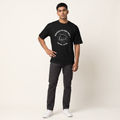 Model wearing Procrastinators Unite oversized t-shirt, front view showing chest print