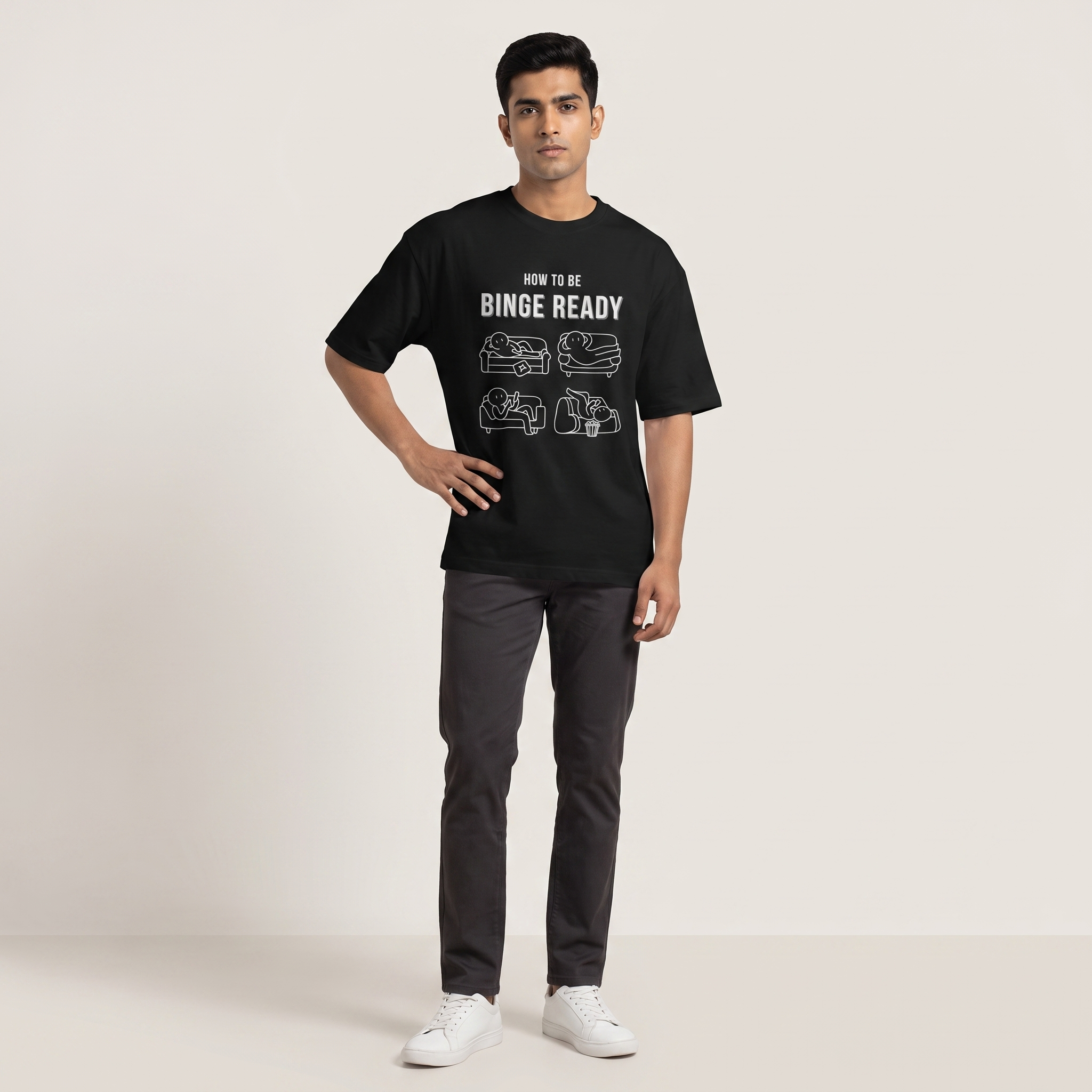 Model wearing Binge Ready oversized t-shirt, front view showing chest print